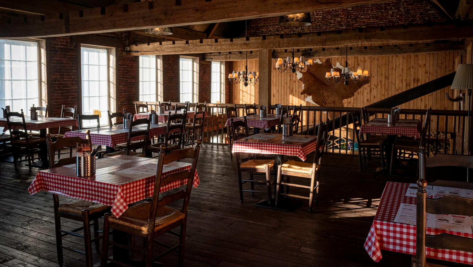 photo of the tables in a restaurant on the upstairs balcony